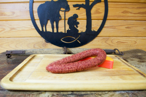 sausage and cheese on a cutting board
